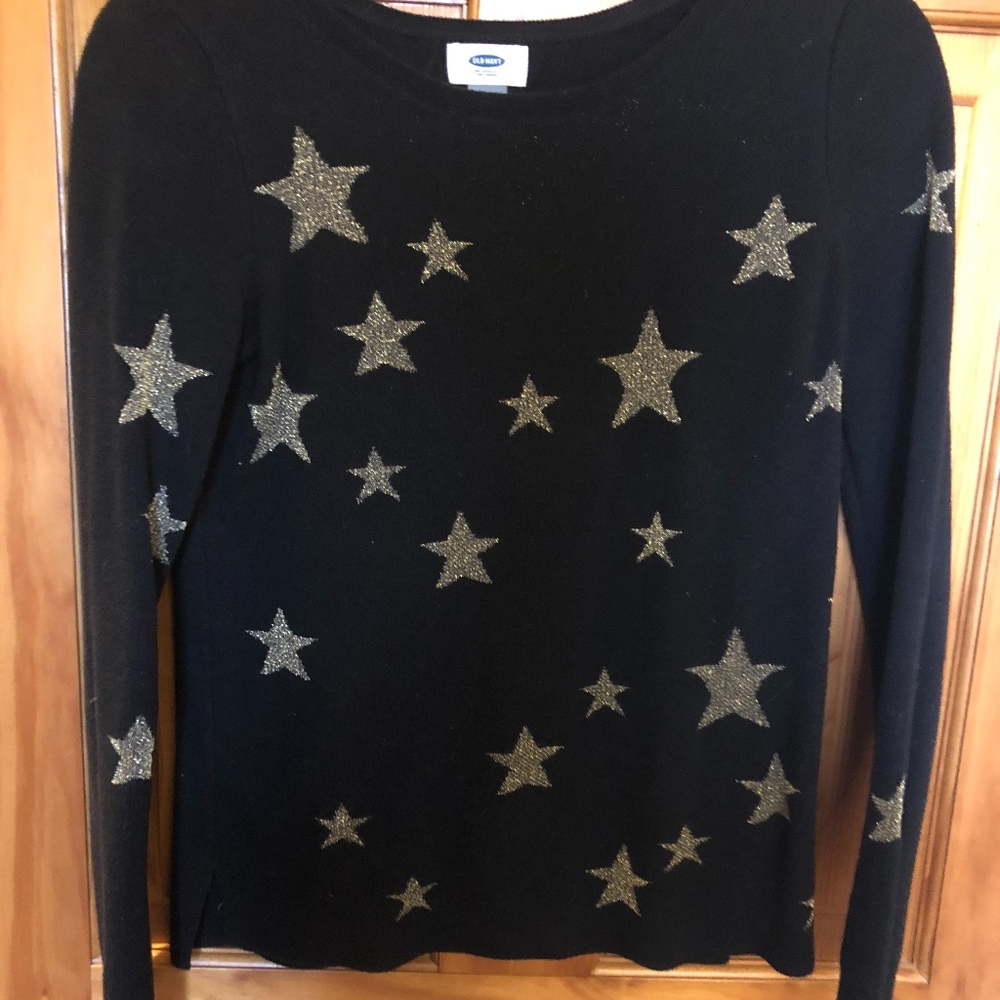Black sweater with gold stars
